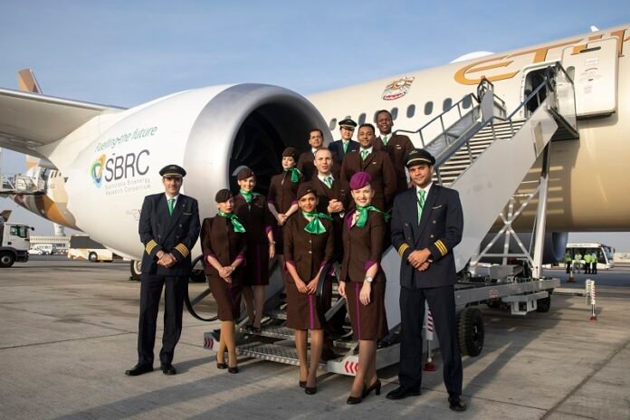 Etihad Airways logo and employees working together